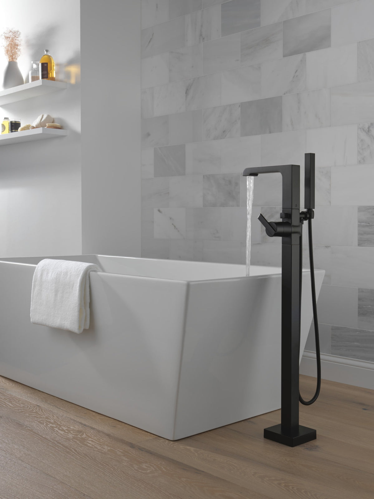 Delta Ara® Single Handle Floor Mount Tub Filler Trim with Handshower Matte Black